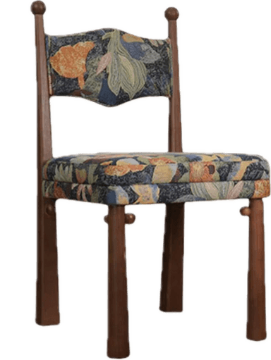A wooden dining chair featuring a dark stained frame and vibrant, multicolored floral upholstery on both the seat and the shaped backrest. The back legs extend upwards to form part of the backrest structure, culminating in turned wood finials. The legs are tapered, and the overall design combines traditional elements with an eclectic upholstery pattern. — 3D model