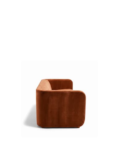 A contemporary three-seater sofa with a sleek, minimalist design. It features a low-profile frame with integrated arms that extend to the front, creating a cohesive look. The upholstery appears to be a soft, plush fabric with a matte finish, and the seat and back cushions are well-defined. The sofa sits on block-style legs integrated into the frame. — 3D model
