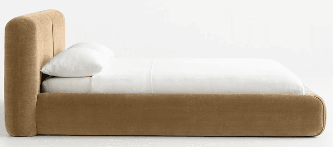 A modern upholstered bed frame with a low profile and a curved headboard. The bed is covered in a textured fabric and includes a mattress with white linens and pillows. — 3D model