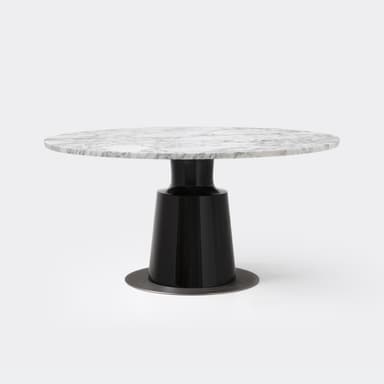 A modern round table featuring a white marble top with grey veining, supported by a glossy black, tapered pedestal base, which rests on a circular dark metal plate. — 3D model