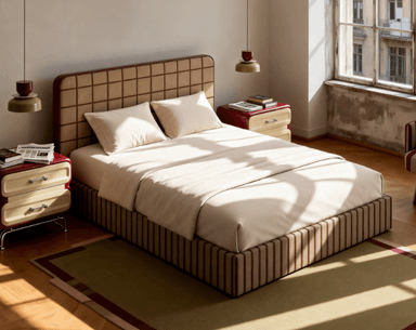 A modern upholstered bed frame with a distinctively patterned headboard and base. The headboard features a grid of square-shaped upholstery in a light tan color with darker brown piping outlining each square. The bed frame itself has a vertical striped pattern in alternating shades of brown and tan. It is dressed with cream-colored bedding, including two pillows and a duvet. Two matching bedside tables with red drawers and light-colored drawer fronts are positioned on either side of the bed. The overall aesthetic suggests a contemporary or retro-inspired design. — 3D model