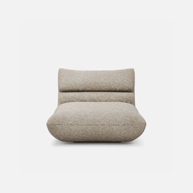 An armless, low-profile lounge chair characterized by its deep, plush cushioning and rounded silhouette. The entire piece is upholstered in a light, speckled fabric, creating a soft and inviting appearance with no visible legs, resting directly on the floor. — 3D model
