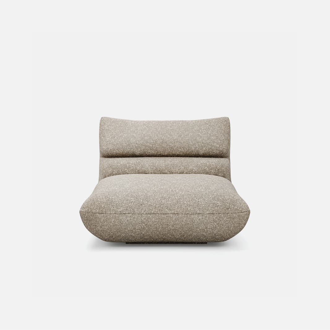 An armless, low-profile lounge chair characterized by its deep, plush cushioning and rounded silhouette. The entire piece is upholstered in a light, speckled fabric, creating a soft and inviting appearance with no visible legs, resting directly on the floor. — 3D model