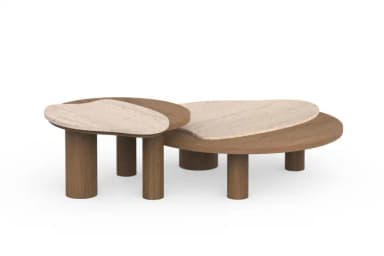 A set of two organically shaped, low-profile coffee tables with unique leg structures. The larger table has a flattened, oval top with a curved edge, and is supported by two cylindrical legs and a single, thicker, column-like leg. The smaller table, nested partially under the larger one, has an irregular, amoeba-like top and is supported by two cylindrical legs. The tops appear to be made of a stone-like material with subtle veining, possibly travertine, while the legs are made of wood with a visible grain. — 3D model