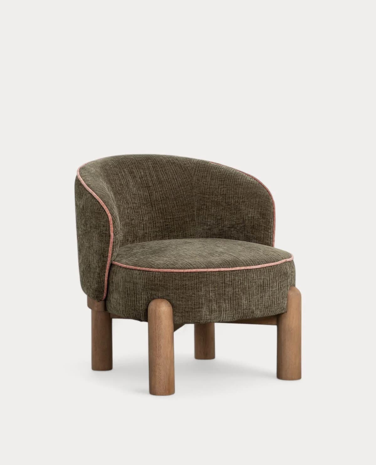 A compact, upholstered accent chair featuring a rounded backrest that flows into integrated arms. The chair is covered in a ribbed, dark green fabric with light pink piping detail along the edges of the back and seat cushion. It stands on four short, cylindrical wooden legs. — 3D model