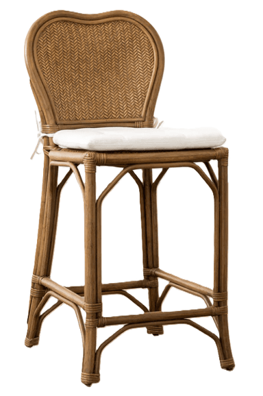 A classic bistro-style bar stool featuring a curved rattan frame and a heart-shaped, tightly woven rattan backrest. The stool includes a light-colored, padded seat cushion secured with white ties. An integrated footrest provides comfort and stability. The natural brown finish of the rattan gives it a warm, inviting aesthetic. — 3D model