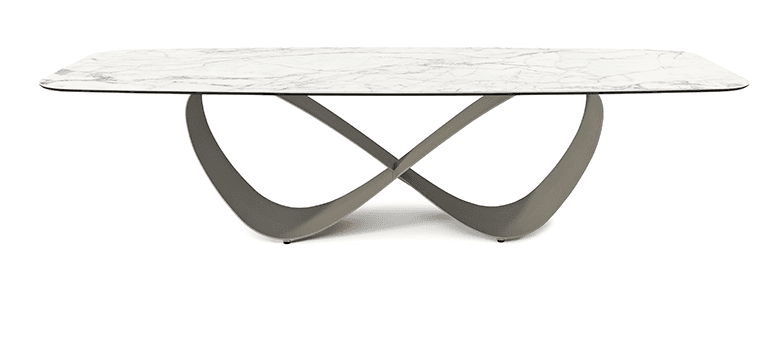 A modern rectangular dining table featuring a white marble-effect tabletop with subtly rounded corners, supported by a distinctive sculptural metal base. The base consists of two intersecting, broad, curved metal elements in a matte gray-taupe finish, creating a dynamic and elegant silhouette. — 3D model