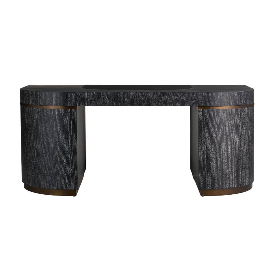 A modern executive desk with a dark, textured finish and curved pedestal bases. It features a rectangular top with a slight curve at the front and a recessed area near the back. The pedestal bases have metallic trim near the top and bottom, adding a decorative element. The overall design is contemporary and sleek. — 3D model