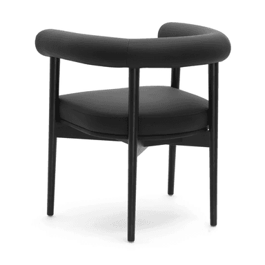 A modern armchair with a curved, upholstered backrest and armrests. The seat is also upholstered, and the chair has a minimalist frame with four slender legs. — 3D model