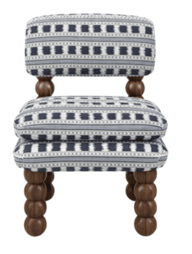 An armless upholstered chair featuring a short backrest and distinctive turned bobbin legs, adorned with a bold geometric maze pattern in navy blue and off-white. — 3D model