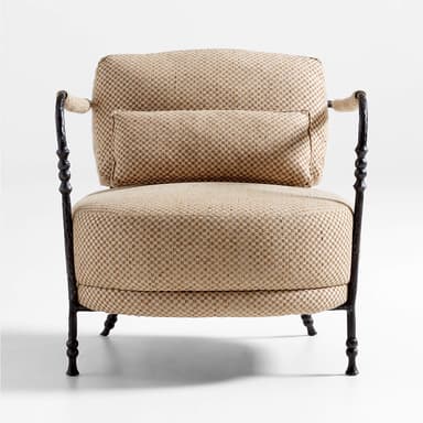 A comfortable lounge chair featuring a dark, textured forged iron frame with decorative baluster-like turnings on the uprights and legs. The armrests are partially wrapped in a contrasting natural rope material. The seat, backrest, and a lumbar pillow are upholstered in a tightly woven, checkered fabric with beige and brown tones. — 3D model