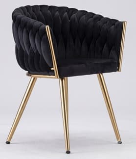 A contemporary accent chair featuring a barrel-shaped back and seat upholstered in plush black velvet. The backrest showcases a distinctive braided or woven pattern. The chair is supported by a sleek, gold-toned metal frame that extends to four tapered, splayed legs. — 3D model