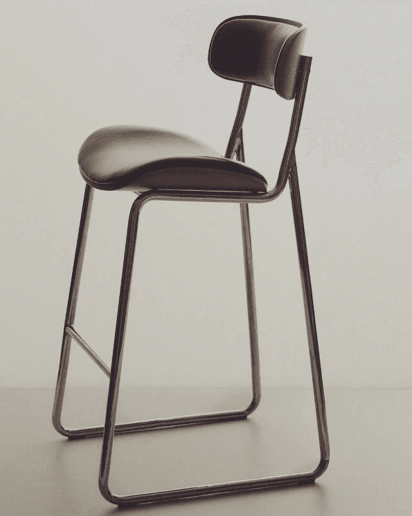 A modern bar stool featuring a bent plywood shell with black upholstered seat and backrest, supported by a sleek tubular metal sled base with an integrated footrest. — 3D model
