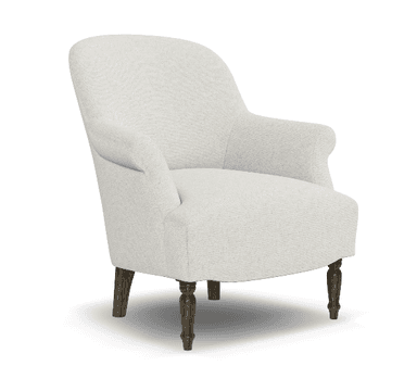 An upholstered armchair viewed from a rear-right angle, featuring a light, neutral-toned fabric. The chair displays classic design elements including a high, subtly curved back and substantial, rolled arms. It is supported by four exposed wooden legs, with the front legs appearing turned or carved, and the rear legs being simpler and tapered. The overall form suggests comfort and a traditional aesthetic. — 3D model