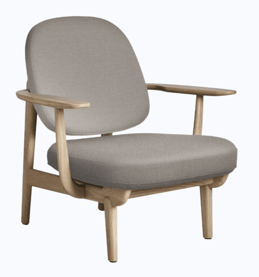 A modern armchair featuring a solid wood frame with a light, natural finish and upholstered seat and back cushions. The backrest is rounded and slightly curved, providing ergonomic support. The armrests are integrated into the wooden frame, extending outwards and downwards. — 3D model