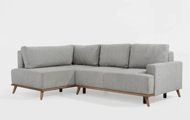 A light grey fabric sofa viewed from the rear and side. It features a three-seat configuration with distinct cushions visible at the top. The sofa has a modern design with clean lines, square arms, and is supported by a combination of dark and wooden tapered legs. The fabric appears to be a textured weave. — 3D model