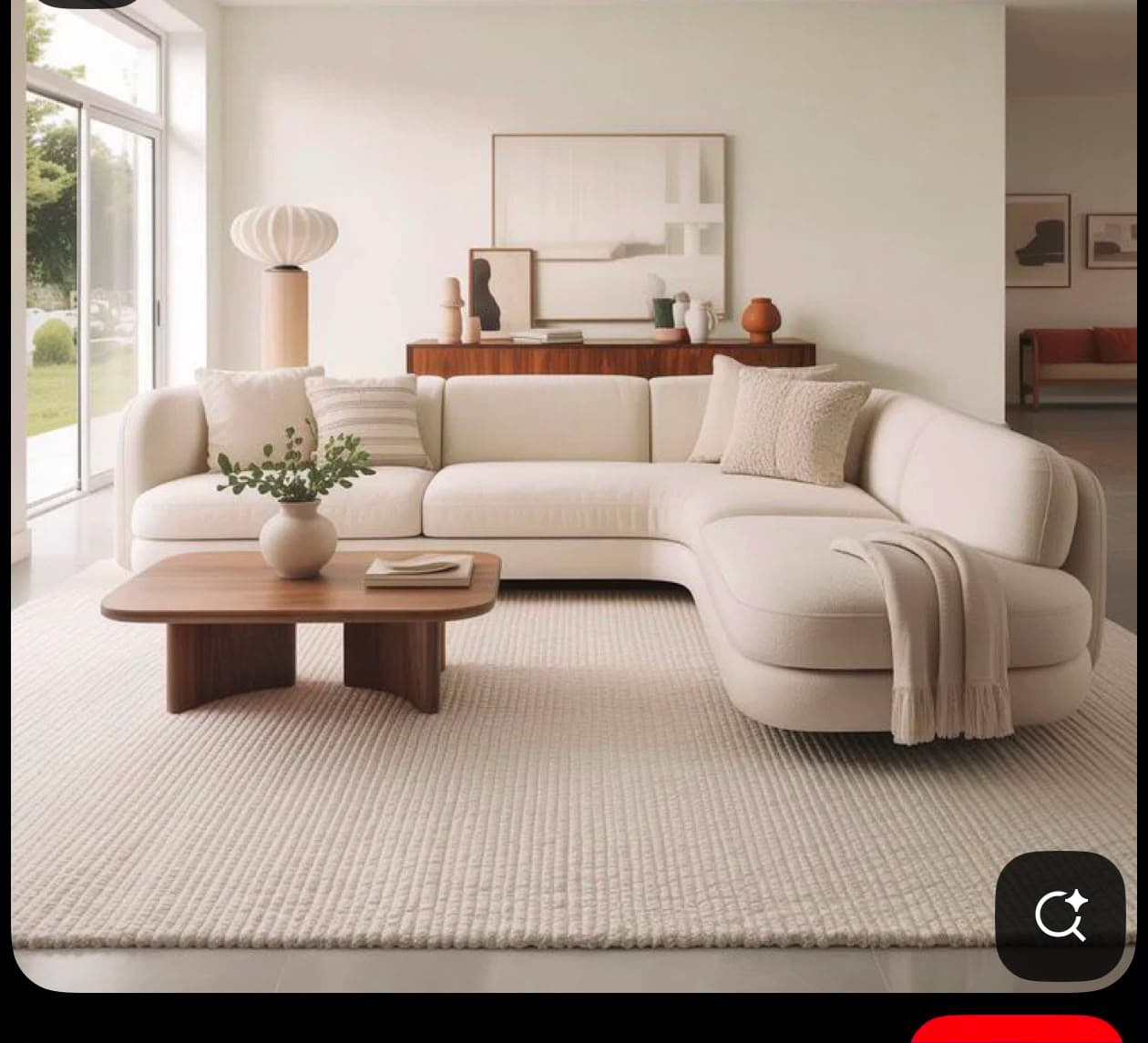 A cream or off-white L-shaped sectional sofa with soft, rounded edges, upholstered in a textured fabric. It features a main two-seat section connected to a single-seat section that extends into a chaise lounge, creating a corner configuration. The design is contemporary and minimalist, with clean lines and no visible legs or intricate detailing, suggesting a low-profile base. — 3D model