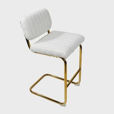 An armless bar stool featuring a contemporary design with a polished gold metal frame and white bouclé fabric upholstery. The stool has a sled-style base with an integrated footrest and a fixed-height seat. Both the seat and the backrest are padded and feature subtle horizontal channel tufting. — 3D model