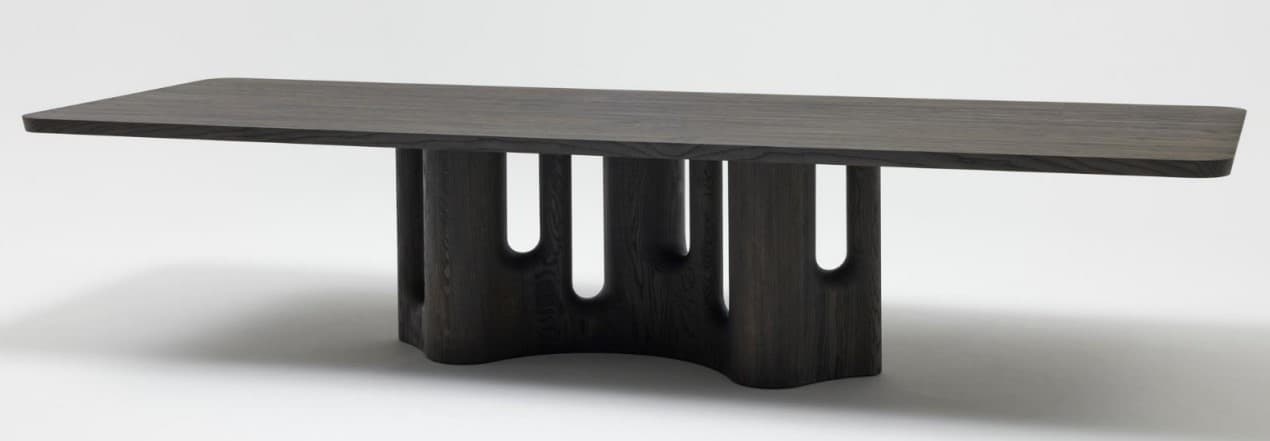 A contemporary coffee table crafted from dark-stained wood, featuring a rectangular tabletop with subtly rounded edges. The table's distinctive base consists of two sculptural, curved pedestals connected by a central element, providing a unique and stable foundation. The design emphasizes clean lines and a minimalist aesthetic. — 3D model