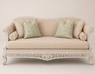 An elegantly carved daybed in a Rococo or French Provincial style, featuring a light beige upholstered seat and backrest, and an elaborately detailed antique white finished wooden frame. It includes multiple decorative pillows, some plain beige and others with a sage green botanical pattern. — 3D model