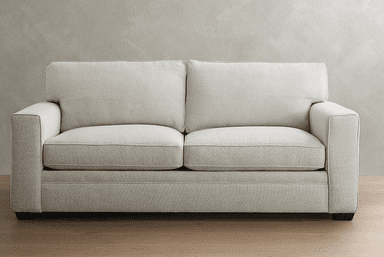 A contemporary upholstered two-seater sofa, commonly known as a loveseat, featuring square track arms and tailored lines. It is upholstered in a light-colored, textured fabric with visible piping detail on the two seat cushions and two loose back cushions. The sofa is supported by short, dark-stained block legs. — 3D model