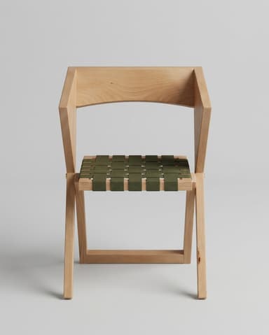 A minimalist folding chair featuring a light-toned wooden frame and an olive green woven webbing seat and backrest. The chair is depicted in a partially open or folded state, suggesting its space-saving design. Its clean lines and simple construction highlight a modern aesthetic. — 3D model