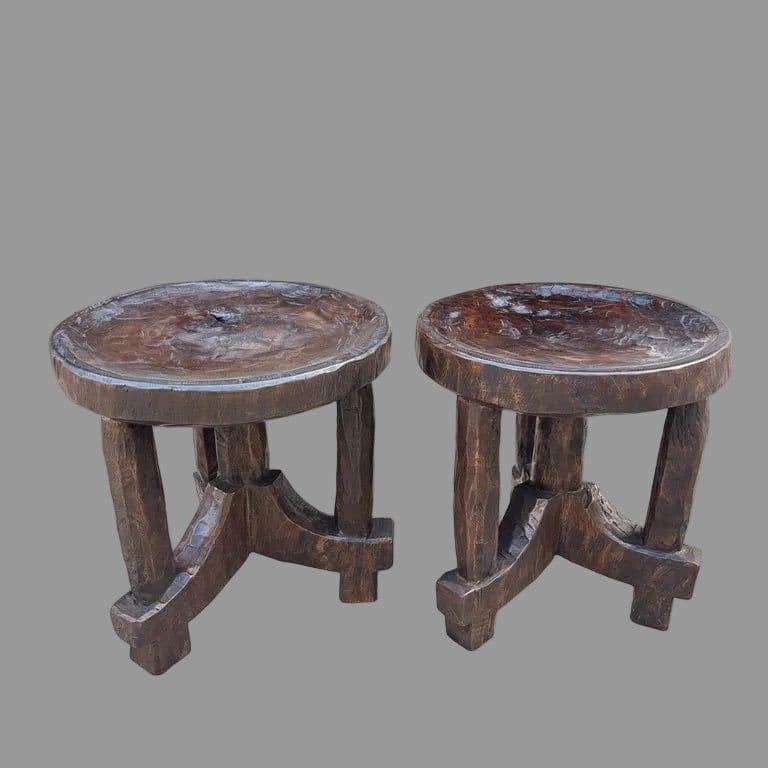 A small, round, dark wood pedestal table with a deeply recessed circular top and a sturdy, cross-braced leg structure. The wood has a highly textured, rustic appearance. — 3D model