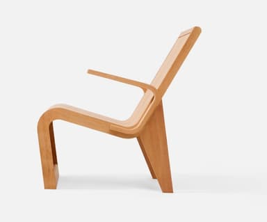 A modernist bent plywood lounge chair with a natural, light wood finish, featuring a reclined backrest and integrated armrests. The chair showcases a continuous, organic form crafted from laminated wood sheets. — 3D model