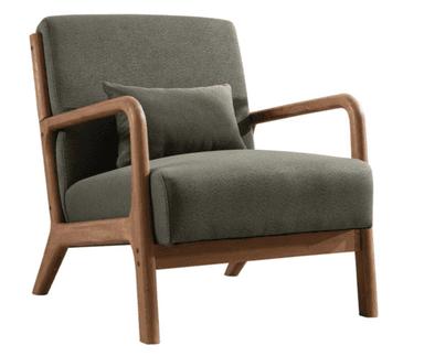 A modern armchair with a wooden frame and upholstered seat and backrest. The frame has a natural wood finish and features curved armrests and angled legs. A small, matching upholstered pillow is placed against the backrest for added comfort. The upholstery appears to be a textured fabric. — 3D model