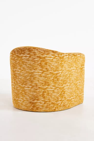 A standalone armchair with a rounded back and seat. The upholstery features a textured pattern in shades of yellow and cream, resembling an abstract animal print or natural fibers. — 3D model