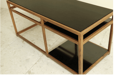 A rectangular coffee table featuring a clear, linear wood frame and two dark, possibly smoked, glass surfaces. The top surface extends across the entire length of the table, while a smaller, square-shaped glass shelf is integrated into the right-hand side of the lower section of the frame. The wooden frame is constructed with clean, straight lines, creating an open and airy aesthetic. The table appears to be in excellent condition, showcasing a modern or contemporary design. — 3D model