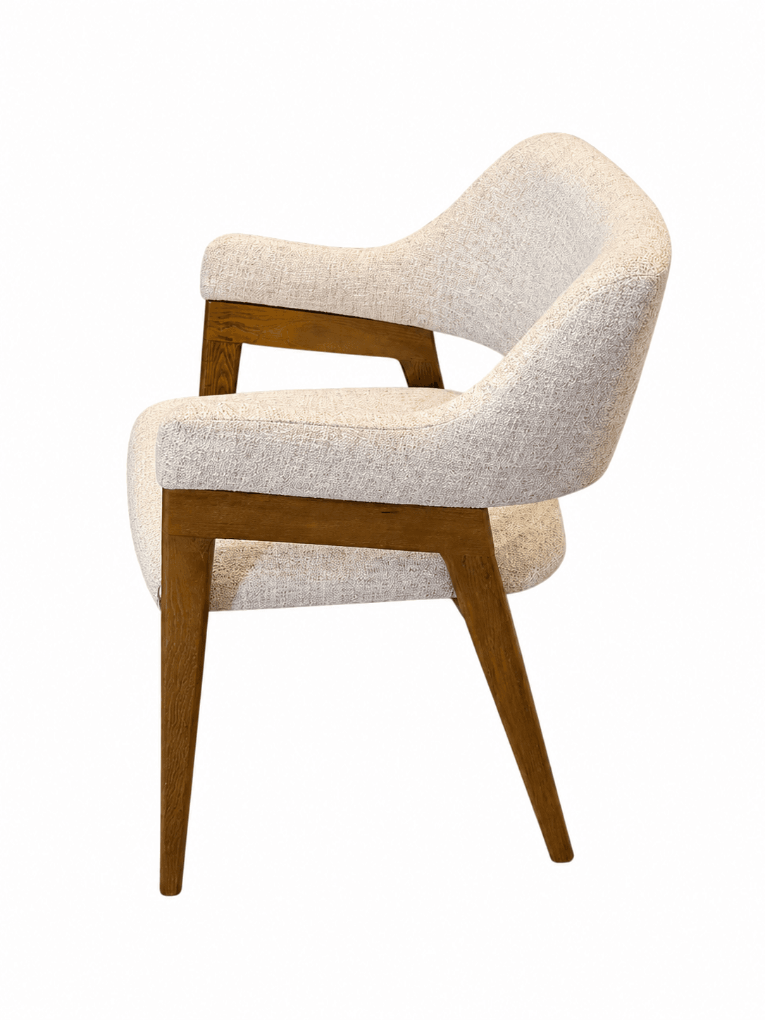 An upholstered armchair in a mid-century modern style, featuring a curved back and seat, light-colored textured fabric, and an exposed wooden frame with integrated armrests and tapered legs. — 3D model