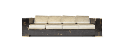 A dark, textured armchair with a patchwork exterior made of wood pieces. The armchair features a low profile with brass or gold-toned block feet. A light-colored cushion is visible at the top. The exterior wood has a rough, uneven grain, with some areas appearing worn or distressed, revealing lighter wood underneath the dark finish. — 3D model