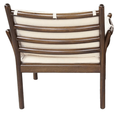 A dark-stained wooden armchair with a tall, slightly curved back and integrated armrests. The chair features upholstered cushions for the seat and back, rendered in a light, off-white fabric. The frame exhibits a minimalist design with slender legs and support structures, suggestive of mid-century modern aesthetics. — 3D model