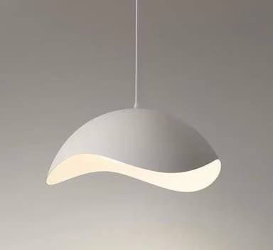 A modern pendant light featuring an organically shaped, undulating shade in a light grey or off-white finish, suspended from the ceiling by a thin cable. The light source is integrated and concealed within the shade, emitting a soft, diffused glow. — 3D model