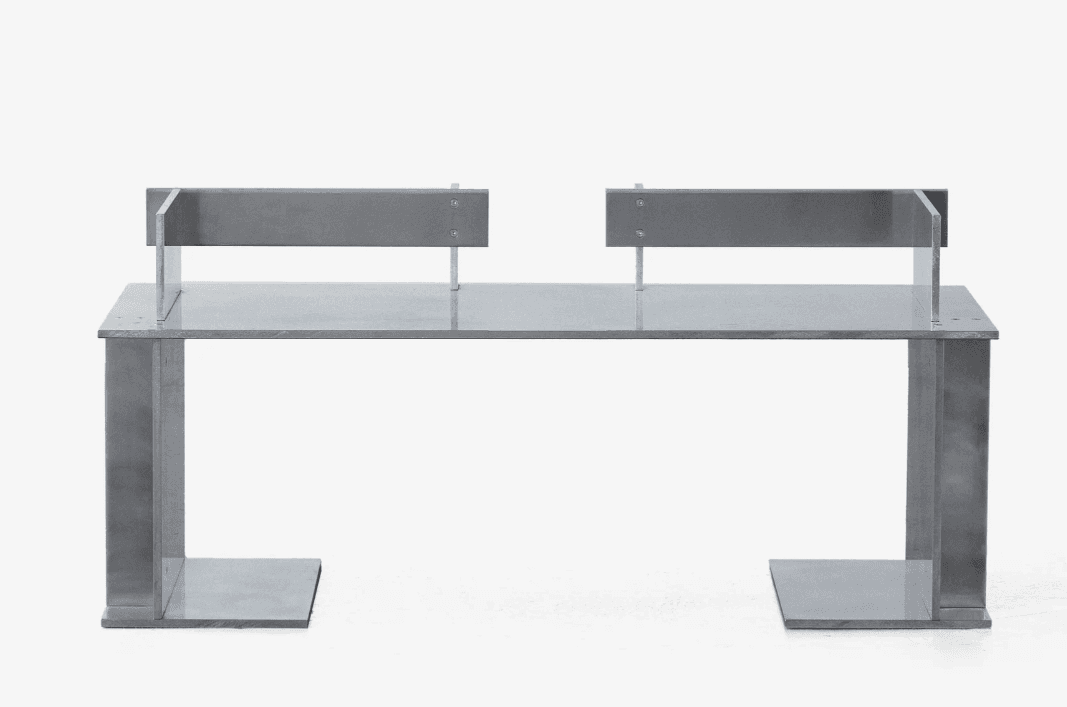A modern console table constructed from metal. It features a rectangular top supported by two substantial U-shaped legs. Two vertical metal dividers extend upwards from the tabletop, positioned towards the rear, creating two distinct sections on the top surface. These dividers are attached with visible screws. The overall design is minimalist and industrial. — 3D model