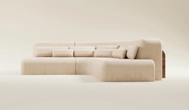 A modular, sectional sofa with a curved design and plush upholstery. It features a low profile with rounded corners and is complemented by multiple scatter cushions. The sofa appears to be constructed from a fabric material and is arranged in an L-shape. — 3D model