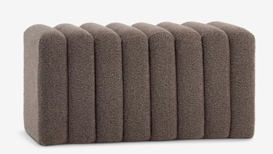 A rectangular, fully upholstered bench featuring a channel-tufted or fluted design, covered in a textured, brown/taupe fabric, likely boucle. — 3D model