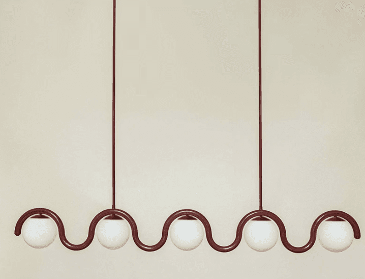 A burgundy chandelier with a wavy metal frame supporting five spherical white glass shades. The chandelier is suspended by thin rods from above. — 3D model