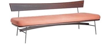 A sleek modern bench featuring a long, cushioned seat upholstered in a peachy-pink fabric, supported by a minimalist dark metal frame. It includes an integrated, gently curved backrest made from dark-toned wood, adding an elegant touch. The design emphasizes clean lines and a contemporary aesthetic. — 3D model
