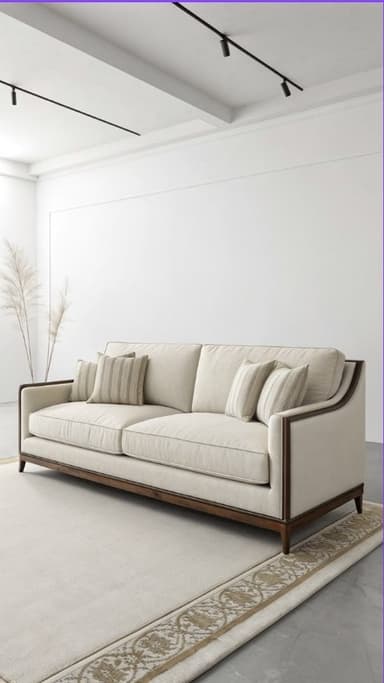 A long, rectangular sofa featuring a prominent exposed dark wood frame outlining the back and sloped arms, upholstered in a light beige fabric. It includes two seat cushions, multiple back cushions, and several decorative throw pillows, some with a subtle striped pattern. The sofa rests on short, tapered wooden legs. — 3D model