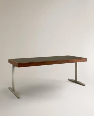 A sophisticated Mid-Century Modern executive desk featuring a rectangular wooden top with a dark inset surface, likely leather or laminate. It includes two integrated drawers and is supported by two polished metal, inverted T-shaped legs, embodying a minimalist design. — 3D model