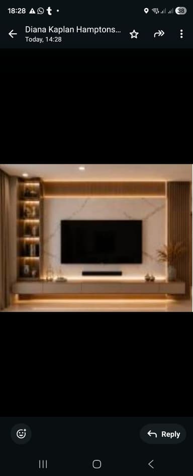 A modern, wall-mounted entertainment center featuring an integrated television panel set against a white, marble-patterned backboard. The unit includes a lower console with drawer storage, vertical slatted wood accents on the right side, and an open shelving unit on the left side, all constructed with light-toned wood and white elements. — 3D model