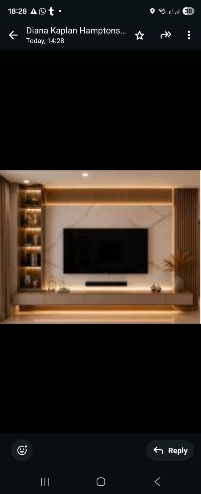 A modern, wall-mounted entertainment center featuring an integrated television panel set against a white, marble-patterned backboard. The unit includes a lower console with drawer storage, vertical slatted wood accents on the right side, and an open shelving unit on the left side, all constructed with light-toned wood and white elements. — 3D model