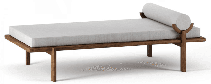 A modern daybed featuring a solid walnut wood frame, a rectangular light gray upholstered mattress, and a matching cylindrical bolster pillow. The bolster is supported by two elegantly curved wooden brackets integrated into the frame's structure. — 3D model