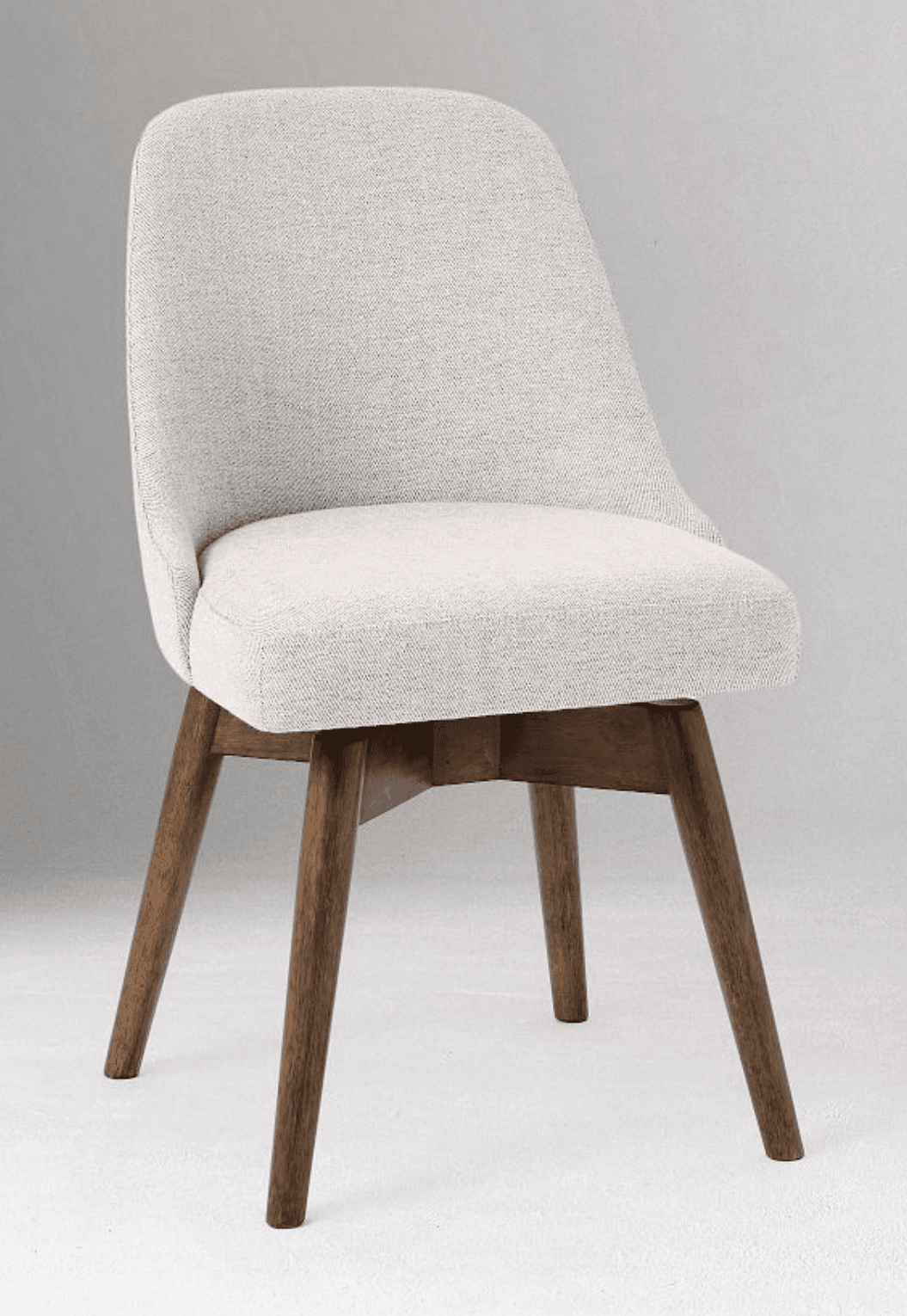 An armless, upholstered side chair featuring a gently curved backrest and a comfortable seat, supported by a splayed base of four tapered wooden legs. — 3D model