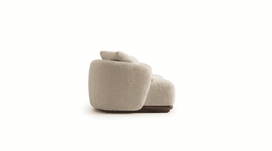 A two-piece modular sectional sofa upholstered in cream boucle fabric, featuring soft, rounded forms and resting on a dark wooden plinth base. One section includes a loose back cushion, and the other has a cylindrical bolster cushion. — 3D model