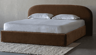 A modern platform bed featuring a continuous upholstered frame and a distinctive curved headboard, presented on a white background with white bedding. — 3D model