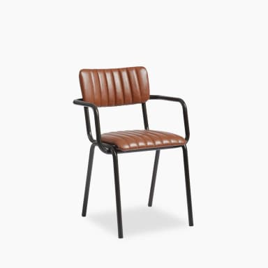 A modern armchair with a low back and armrests. The seat and backrest are upholstered with brown material featuring vertical channel tufting. The frame and legs are constructed from black metal, forming a minimalist silhouette. — 3D model