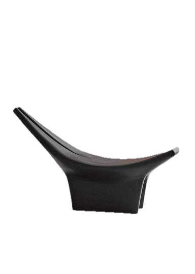 A striking, sculptural lounge chair crafted from a dark, apparently solid material, featuring a deeply reclined seat that integrates into a distinctive split backrest resembling two upward-curving horns. The chair rests on a solid, rectilinear base, and its surface exhibits subtle striations, suggesting a milled or sculpted construction. — 3D model